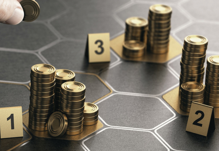 an image of gold coins being partitioned into three stacks